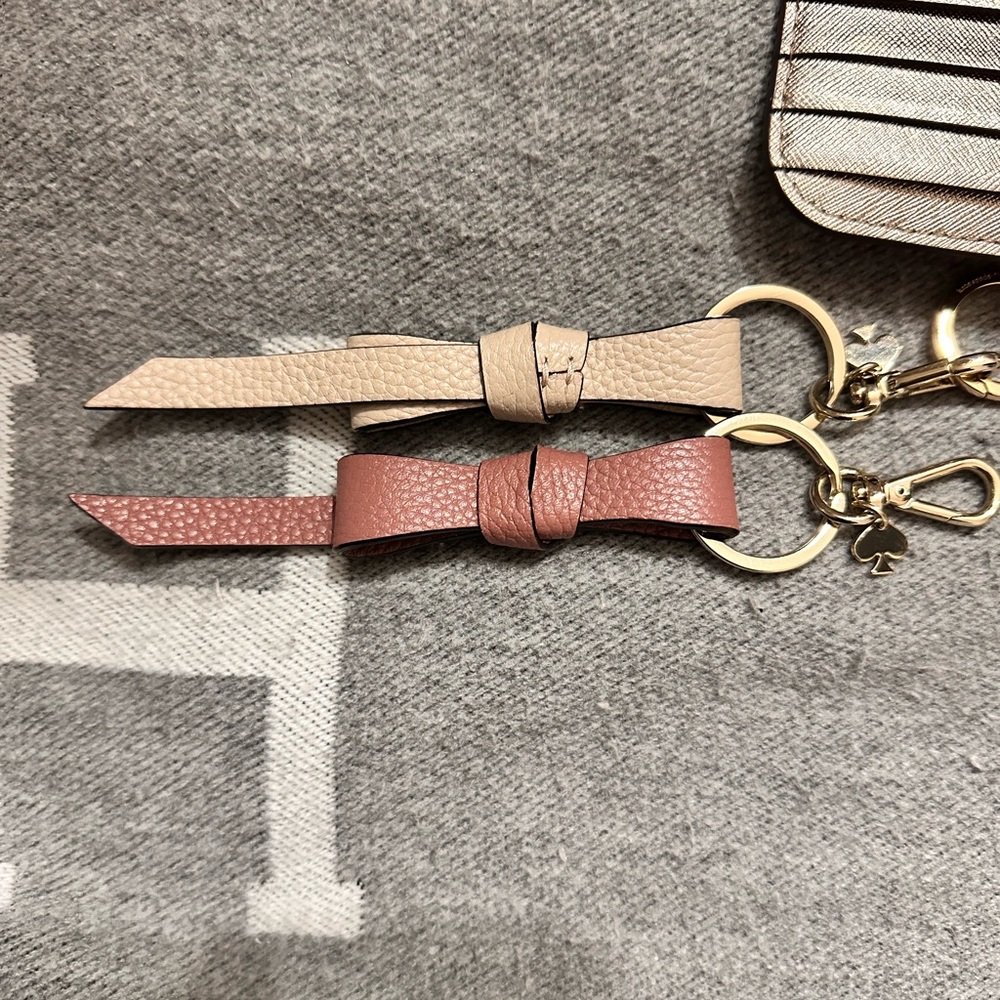 2x Mauve & Khaki Kate Spade Leather Ribbon Keychains